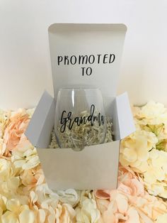 two wine glasses in a gift box with the words, promote to grandma on them