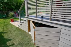 the back side of a house that has been built into the ground and is being used as a storage area