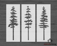 three pine trees cut out from white paper on a wooden background with the words stencil chip