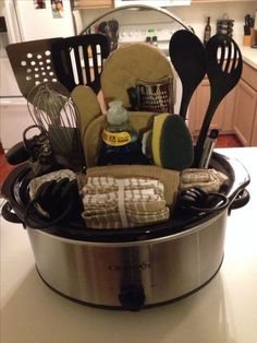 a crock pot filled with cooking utensils