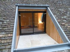 an open door on the roof of a building