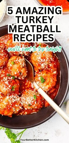 a pan filled with meatballs covered in sauce and topped with parmesan cheese