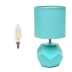 a blue table lamp next to a light bulb