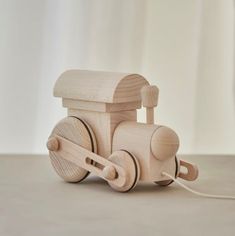 a wooden toy train sitting on top of a table