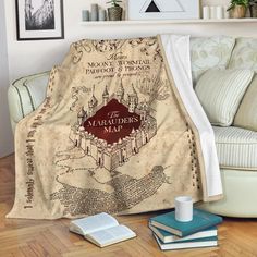 harry potter's map throw blanket with hogwarts house and maradoros on it