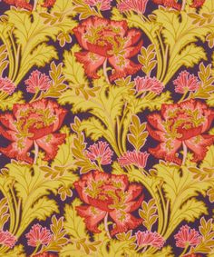 an orange and pink floral pattern on yellow fabric, with red flowers in the center