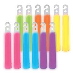 six neon colored toothbrushes are lined up in a row on a white background