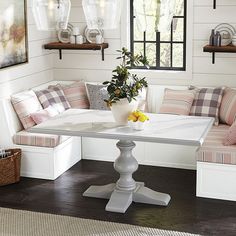 a white table and some chairs in a room