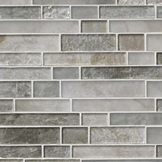 a tile wall with grey and white colors