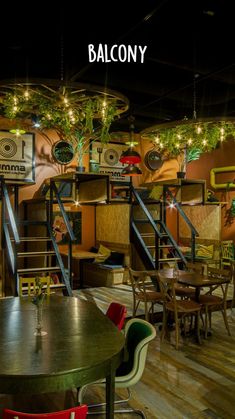 the interior of a restaurant with wooden tables and chairs