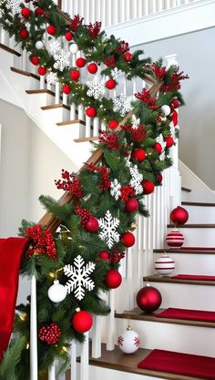 christmas decorations on the banisters and stairs are decorated with red, white and green ornaments