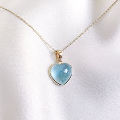 This stunning heart pendant is set in 14k Solid Yellow Gold with Natural Aquamarine with utmost precision. It is an unique gemstone Pendant for nearly every occasion and is completely hassle-free jewelry. ITEM DETAILS: * Gem: Aquamarine * Gem Size: 13X13mm * Gem Shape: Heart * Gem Weight:7.83 carats * Gold Purity: 14KT * Gold Weight: 0.56 gram * Total Weight of the Pendant: 2.13 gram The Gold purity is guaranteed and it comes with authentic 14KT gold hallmark. Since my items are handmade, they are absolutely nickel and lead free. CUSTOMIZATION: * Gemstone customization is available and it can be substituted with a gem of your choice. Kindly message me for the same. PACKAGING * The Pendant comes with layers of safe and secure wrapping along with Free handmade jewelry box with every purchase Heart Gem, Pisces And Aquarius, Aquamarine Gem, Handmade Jewelry Box, Aquamarine Jewelry, March Birthstone, Bezel Pendant, Jewelry Essentials, Heart Gemstone