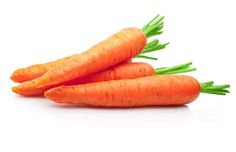 three carrots with green tops on a white background