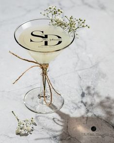 a martini glass with some flowers in it