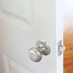 an open door with two knobs on it