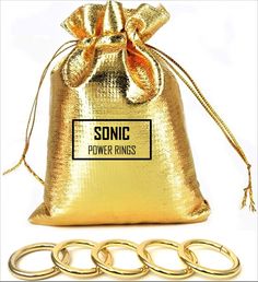 a gold bag with the words sonic power rings on it next to some metal circles