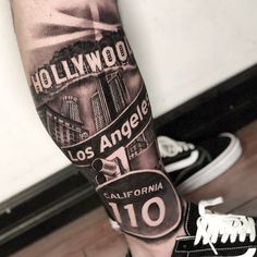 a person with a tattoo on their leg that reads hollywood, los angeles and california