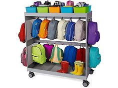 a metal rack with many bags and backpacks on it's sides, all in different colors