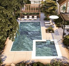 an aerial view of a swimming pool surrounded by greenery