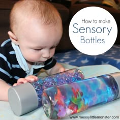 a baby playing with a water bottle on top of a bed that says how to make sensory bottles