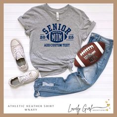 Are you looking for a shirt to show your pride for your favorite Senior football player?  Look no further.  Our shirt features the words Senior Mom and the year.  This is perfect for gameday, Senior night and all season long.  Make this custom by choosing your shirt color, design color and adding your own team name or other custom text.  These are perfect for Friday Night lights, or just showing your support.  Perfect gift for any Senior Football Mom.  Shirts are super comfortable and will take Senior Mom Football Shirt Ideas 2024, Football Senior Night Shirt Ideas, Varsity T-shirt For College Football Season, Collegiate T-shirt With Name Print For Fans, Pre-shrunk Shirt For Sports Fans, Football Season Fan Apparel T-shirt With Name Print, Varsity T-shirt For Football Season Sports Events, Varsity College T-shirt For Football Season, Collegiate Graphic Print Shirt For Sports Events