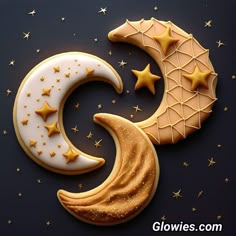 the moon and star cookies are decorated with royal icing