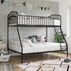 a black metal bunk bed sitting on top of a hard wood floor