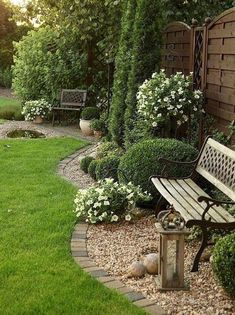 a wooden bench sitting in the middle of a garden