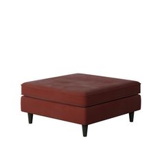 a red ottoman sitting on top of a white floor