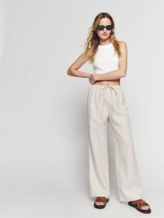 Wear the pants. The Olina is fitted in the waist with a relaxed fitting leg. It has a drawstring waist so you can make it looser or tighter to make it more comfortable. Length is designed to be worn with heels/hemmed to your liking. Linen Pant, Flats Outfit, Wide Leg Linen Pants, Linen Top, New Tops, Linen Pants, Linen Fabric, Drawstring Waist, Wide Leg Pants