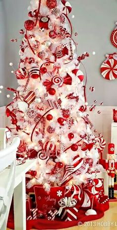 a red and white christmas tree decorated with candy canes