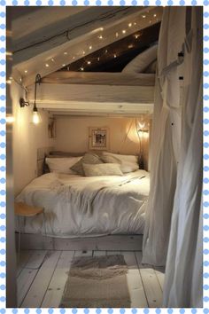 a bed sitting in the middle of a room under a roof with lights on it