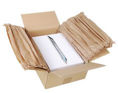 an open cardboard box with a pen in it