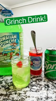 some drinks are sitting on a counter with the words grinch drink written above them