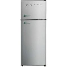 a silver refrigerator freezer sitting on top of a white wall