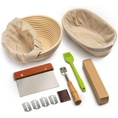 an assortment of kitchen tools and accessories laid out on a white surface