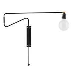 a black lamp with a light bulb hanging from it's side on a white background