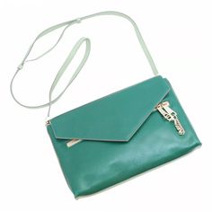 This Chloe ‘Cassie’ Shoulder Bag Combines A Streamlined Silhouette And Playful Metal Detailing. Composed Of Dark Green Lambskin Leather On The Front And Light Green Goatskin Leather On The Back, This Bag Has A Timeless Envelope Shape. A Chain Zipper Pull Detail Dangles From The Front. Tuck The Shoulder Strap Into The Bag To Turn This Crossbody Into A Sleek Clutch. Shiny Brass Double Zip With A Detachable Linked Chain For The Front Pocket And Chain Details On Both Ends Of The Strap. Magnetic Stud Closure. Lined In Soft Beige Lambskin With One Interior Slip Pocket. Bnwt- Purchased But Never Worn. Perfect Condition. No Dust Bag 28x18x4 Cm Can Be Used As A Shoulder/Cross Body B Green Envelope, Front Tuck, Green Envelopes, Soft Beige, Lambskin Leather, Crossbody Shoulder Bag, Light Green, Dark Green, Cross Body