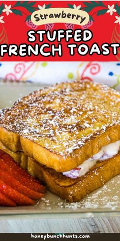 a french toast sandwich with strawberries on the side