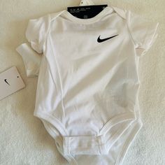 Nike 3 Piece Bodysuits (Onesies) 3 Months White Basic Fitted Onesie For Spring, Casual White Short Sleeve Bodysuit For Play, Fitted White Onesie For Playtime, White Fitted Onesie For Playtime, White Stretch Cotton Bodysuit, White Casual Sports Bodysuit, White Stretch Bodysuit For Playwear, White Casual Bodysuit For Sports, Casual White Short Sleeve Bodysuit For Spring