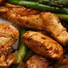 chicken and asparagus on a plate ready to be eaten