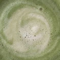 the top view of a green bowl filled with liquid