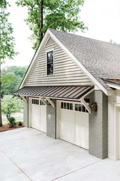 Sage green painted brick home with separate garage. Green Painted Brick, Garage Awning, Carport Modern, House Awnings, Garage Pergola, Garage Exterior, Garage Door Design, Home Exterior Makeover