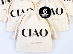 three bags with the names of different brands on them and one has a black circle in it