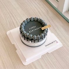 a birthday cake sitting on top of a white plate with a happy birthday message written on it