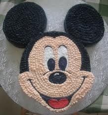 a mickey mouse cake on top of a table