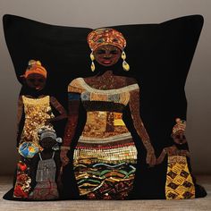 a pillow with an african woman and two children on it