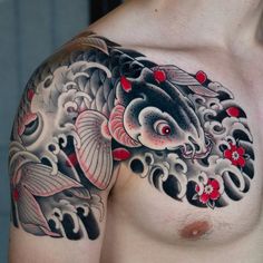 a man with a tattoo on his chest has a koi fish in the water