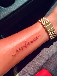 a woman's arm with the word sublime written on it, in cursive font