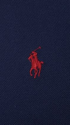 the polo shirt has a red horse on it